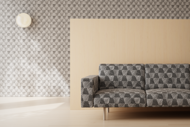 A sofa with a patterned textile sits in front of a wood wall.